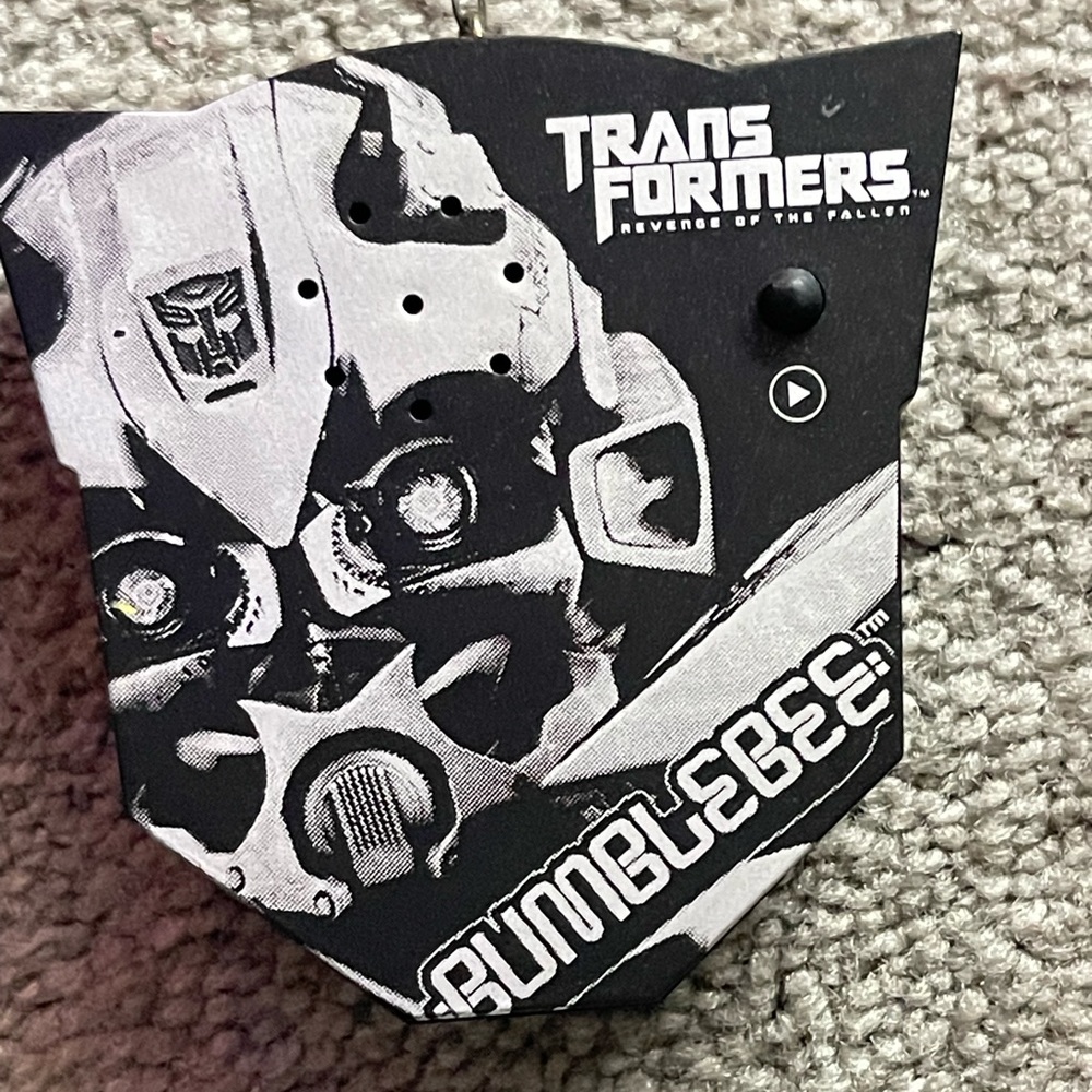 Transformers Bumblebee ornament.  Eyes turn red & plays “I’m so excited”.